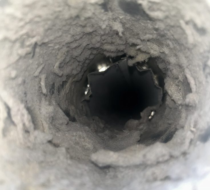 Dryer vent packed with lint before cleaning